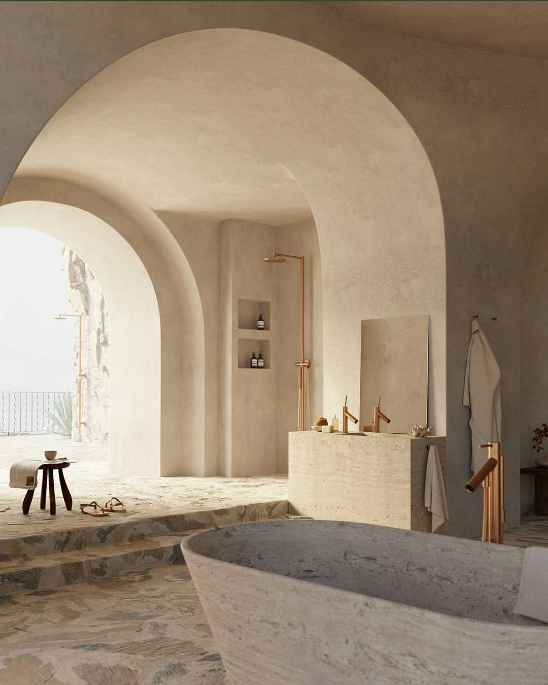 Casa de banho com torneiras de duche e de banheira em dourado AXOR Starck